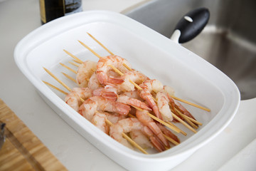 Fried shrimp with lemon on a white plate oven old wooden backgro
