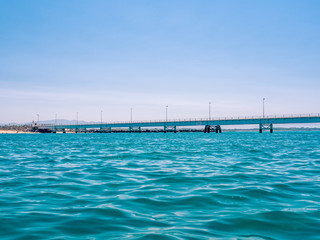 Obraz premium Bridge on the sea in Italy