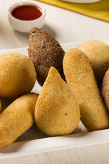 Mixed brazilian snack on the table.