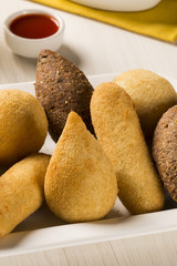 Mixed brazilian snack on the table.