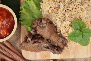 Chicken noodle with sauce tomato is delicious.