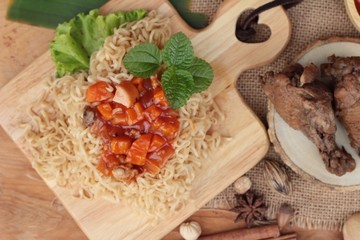 Chicken noodle with sauce tomato is delicious.