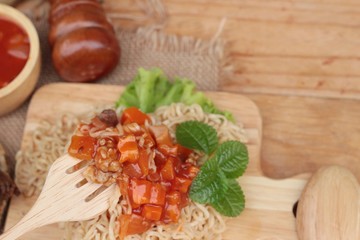 Chicken noodle with sauce tomato is delicious.