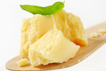 Parmesan cheese on wooden spatula