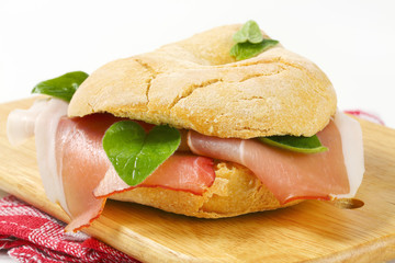 Bread roll (friselle) with slices of Schwarzwald ham