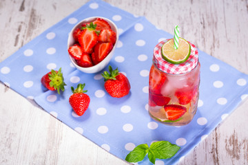Summer strawberry lemonade in a jar glass