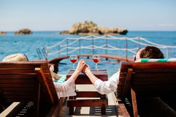 honeymoon couple relax on beach wth sea view