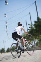 young woman cycling in the park