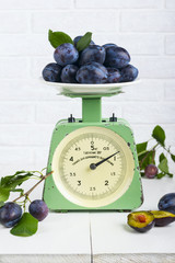Plum fruit on old vintage scale 1960. One division of 20 grams. Only for domestic use