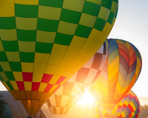 Hot air balloons against the sun