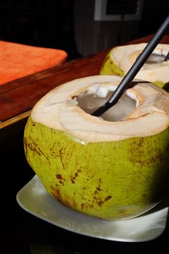 Fresh ice cold drinking green young coconut 