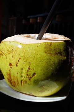 Fresh ice cold drinking green young coconut 