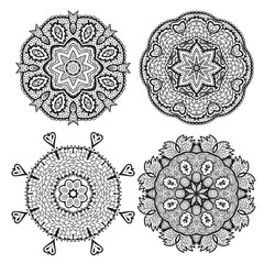 Set of round decorative ornaments, black and white floral pattern