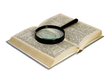 Magnification glass over a opened book,on a white background.