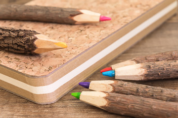 natural wooden pencils and cork workbook
