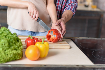 Loving couple cooking healthy food