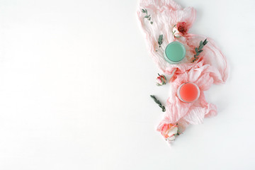 workspace. roses  with textile on white background. Overhead view. Flat lay, top view