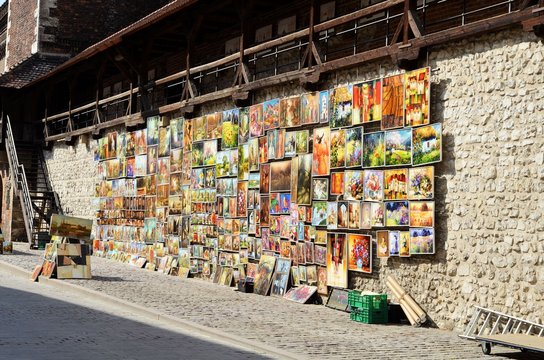 Krakow, Poland - August 7, 2013: At the gate of St. Florian's artists sell their paintings.