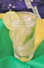 fresh lime caipirinhas on Brazilian flag