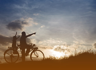 Obraz premium Biker family silhouette father and son