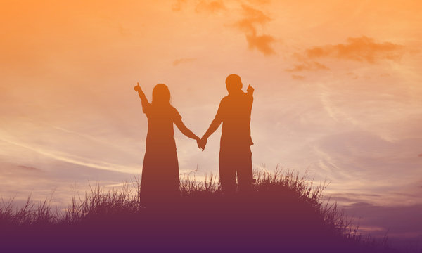 Young couple in love at sunset on the Mountain