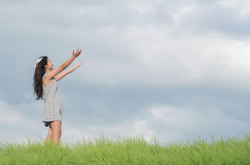 Carefree woman having a good time at the meadow