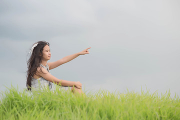 happy woman in wreath outdoors summer enjoying life opening hand