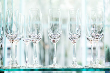 Many empty glasses in a line