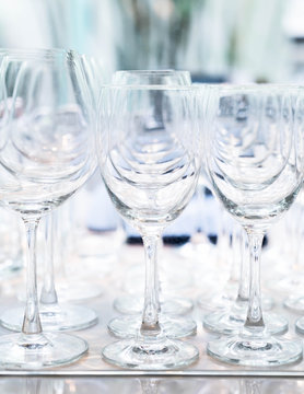 Many empty glasses in a line