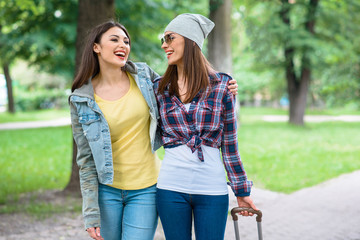 Carefree young women having walk in nature