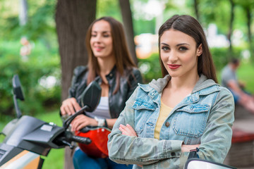 Happy two women traveling by bike