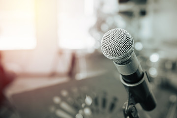 Closeup of microphone in music studio blurred background,blue to