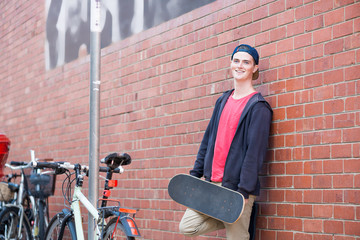 Handsome guy with skateboard