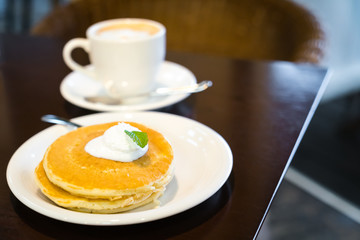 Pan cake with ice cream on table
