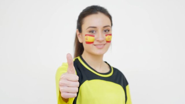 Girl with Spanish Flag Showing Thumb Up