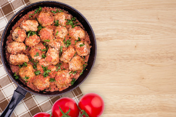 Homemade meatballs in tomato sauce.