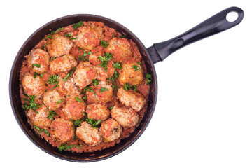 Stewed meatballs in a pan isolated on white background.