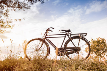 Fototapeta na wymiar beautiful landscape image with vintage Bicycle at sunset