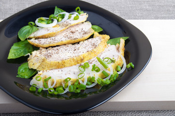 Slices of stewed chicken with basil and green onions