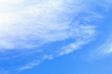 Blue sky background with white clouds. The vast blue sky and clouds sky on sunny day. White fluffy clouds in the blue sky.