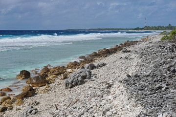 Sea shore on the entry of the Tiputa pass, atoll of Rangiroa, Tuamotu archipelago, French Polynesia, Pacific ocean