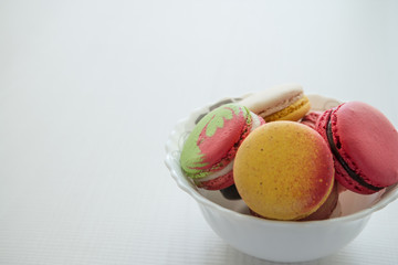 Colorful france macarons on white background