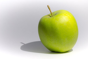 apple with shadow on a gray background