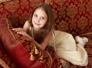 Fototapeta premium Girl sitting on the couch