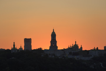 Kyiv pechersk lavra with golden cupola at sunset