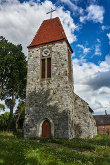 Fototapeta premium Stone tower of the Catholic Church in Poland.