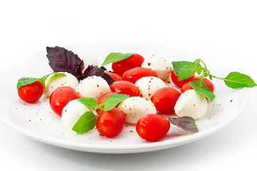 Tomatoes with mozzarella and basil.