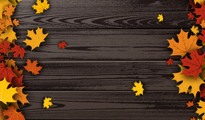 Wooden texture background with maple leaves.