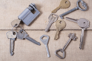 Set od assorted different keys on wooden background