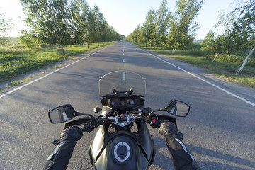Traveling on a motorcycle on the mountain roads.